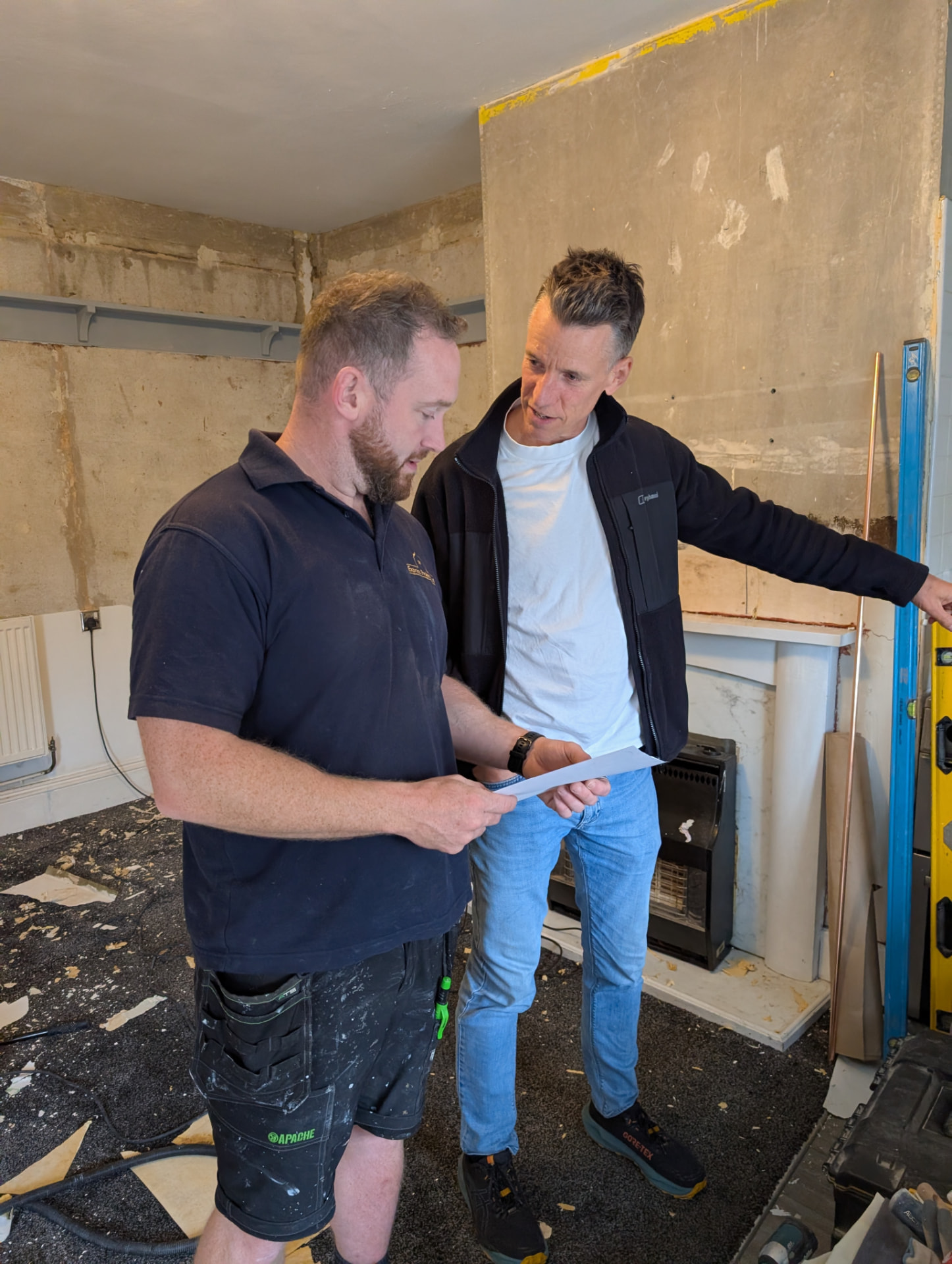 Nev on site with a trusted builder overseeing light refurbishment works